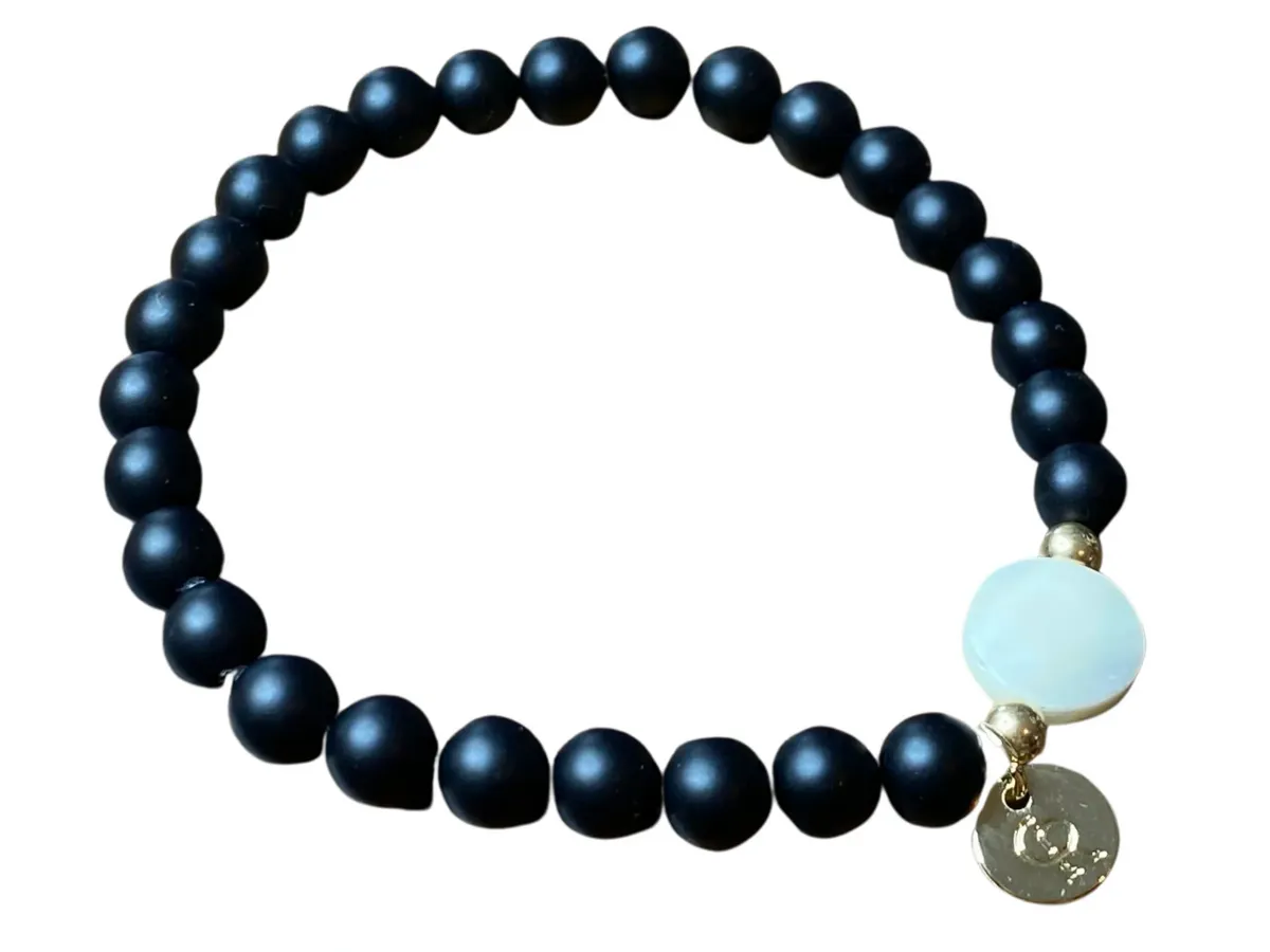 Black beaded bracelet on a white background